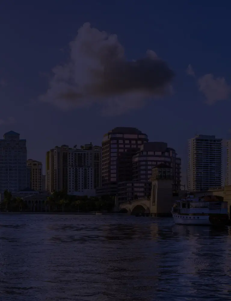 a city skyline with a bridge over water